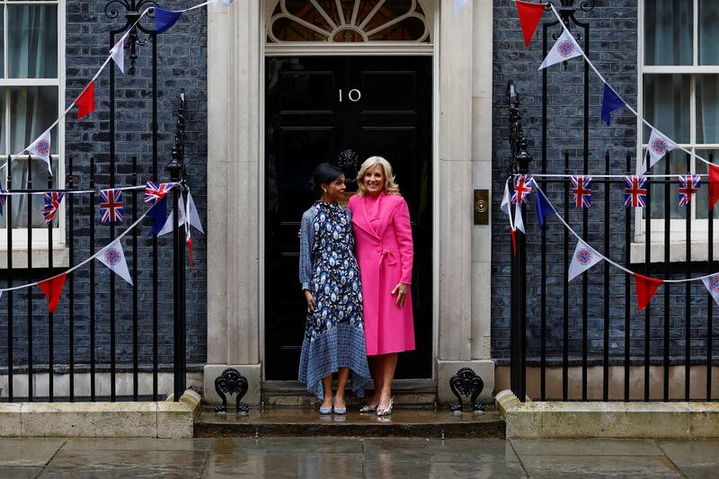 Embracing prints in a silk midi dress by Rixo while meeting US first lady Jill Biden. Reuters 