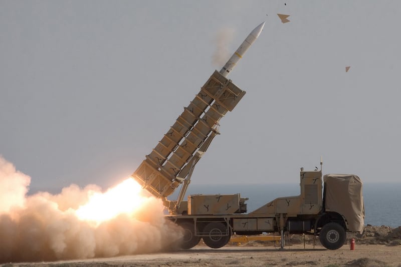 Iranian soldiers fire a missile  in Baluchestan, near the shore of the Sea of Oman, during a military exercise on November 8, 2021. Iranian Army via AFP