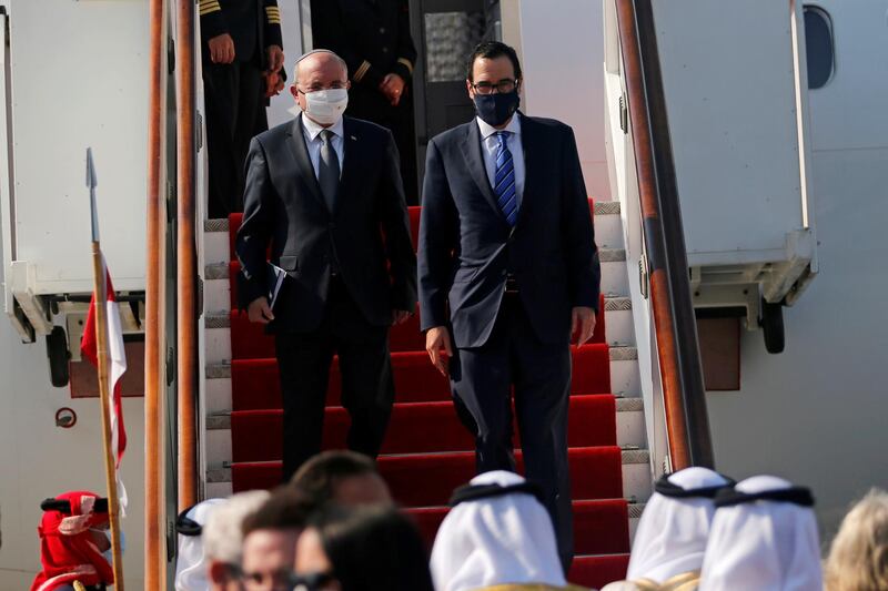 Israeli National Security Adviser Meir Ben-Shabbat and US Treasury Secretary Steve Mnuchin disembark the plane upon their arrive in Muharraq, Bahrain.   Reuters