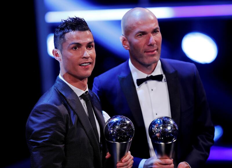 Cristiano Ronaldo celebrates after winning the FIFA Men’s Player of the Year award, while Zinedine Zidane won Coach of the Year award in London in 2017. Eddie Keogh / Reuters