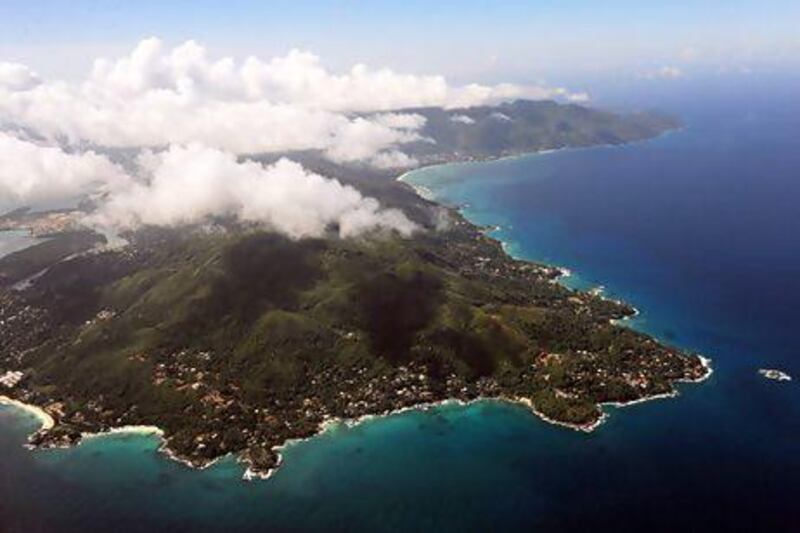 Clouds rise above the Seychelles main island of Mahé. Roberto Schmidt / AFP