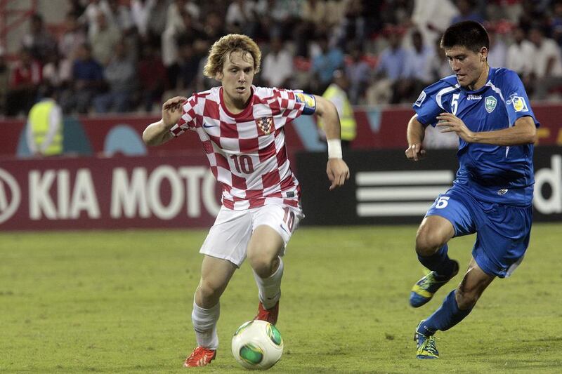 Croatia’s Alen Halilovic, left, in action against Uzbekistan in Fujairah, UAE on October 24, 2013 during the Fifa Under 17 World Cup. Jeffrey E Biteng / The National