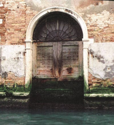 Doorway of a building in Venice showing the raised water level and degraded brickwork. Photo credit: Anna Somers Cocks
