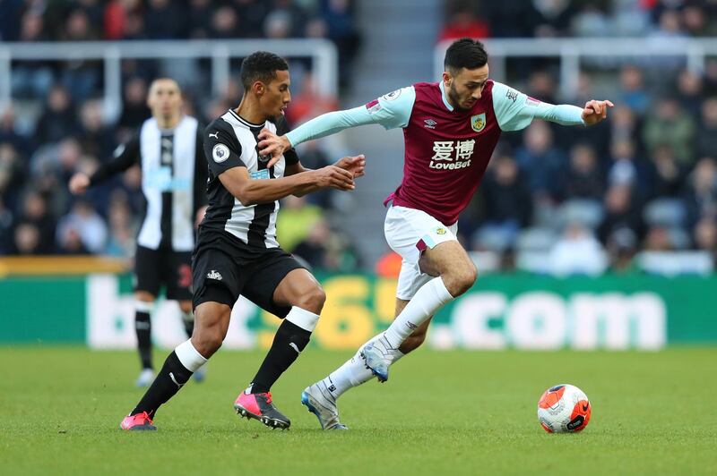 NEWCASTLE UPON TYNE, ENGLAND - FEBRUARY 29: Dwight McNeil of Burnley is challenged by Isaac Hayden of Newcastle United during the Premier League match between Newcastle United and Burnley FC at St. James Park on February 29, 2020 in Newcastle upon Tyne, United Kingdom. (Photo by Alex Livesey/Getty Images)