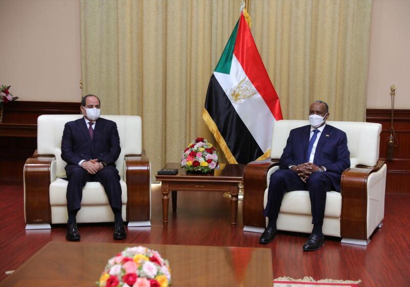 Sudan's Sovereign Council Chief General Abdel Fattah al-Burhan meets with Egyptian President Abdel Fatah al-Sisi, in Khartoum, Sudan March 6, 2021. Sudan Sovereign Council/Handout via REUTERS ATTENTION EDITORS - THIS IMAGE WAS PROVIDED BY A THIRD PARTY.