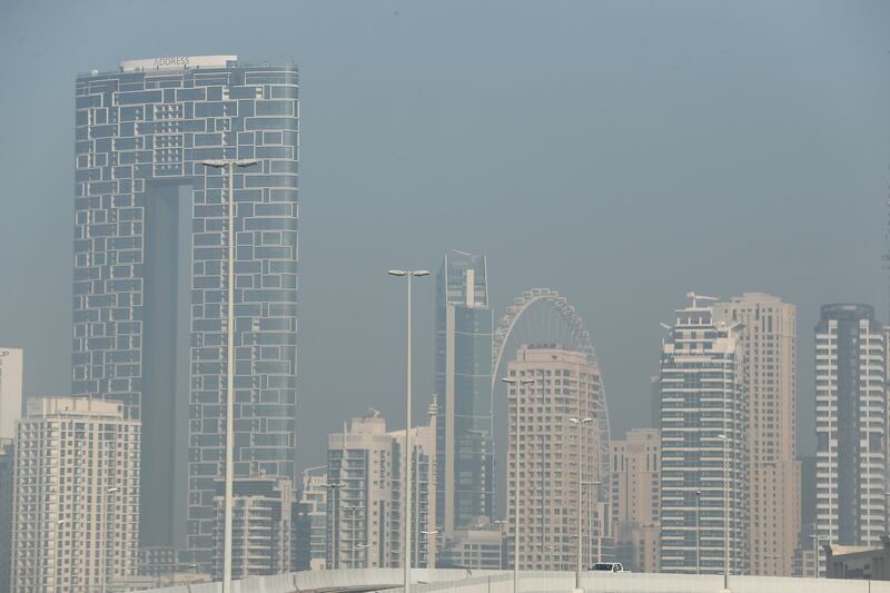 Dubai Marina and Ain Dubai pictured among the morning haze. Pawan Singh / The National