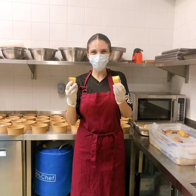 Kenza Jarjour, one of the owners of Inked, prepares meals for donation to the Dubai Food Bank. 