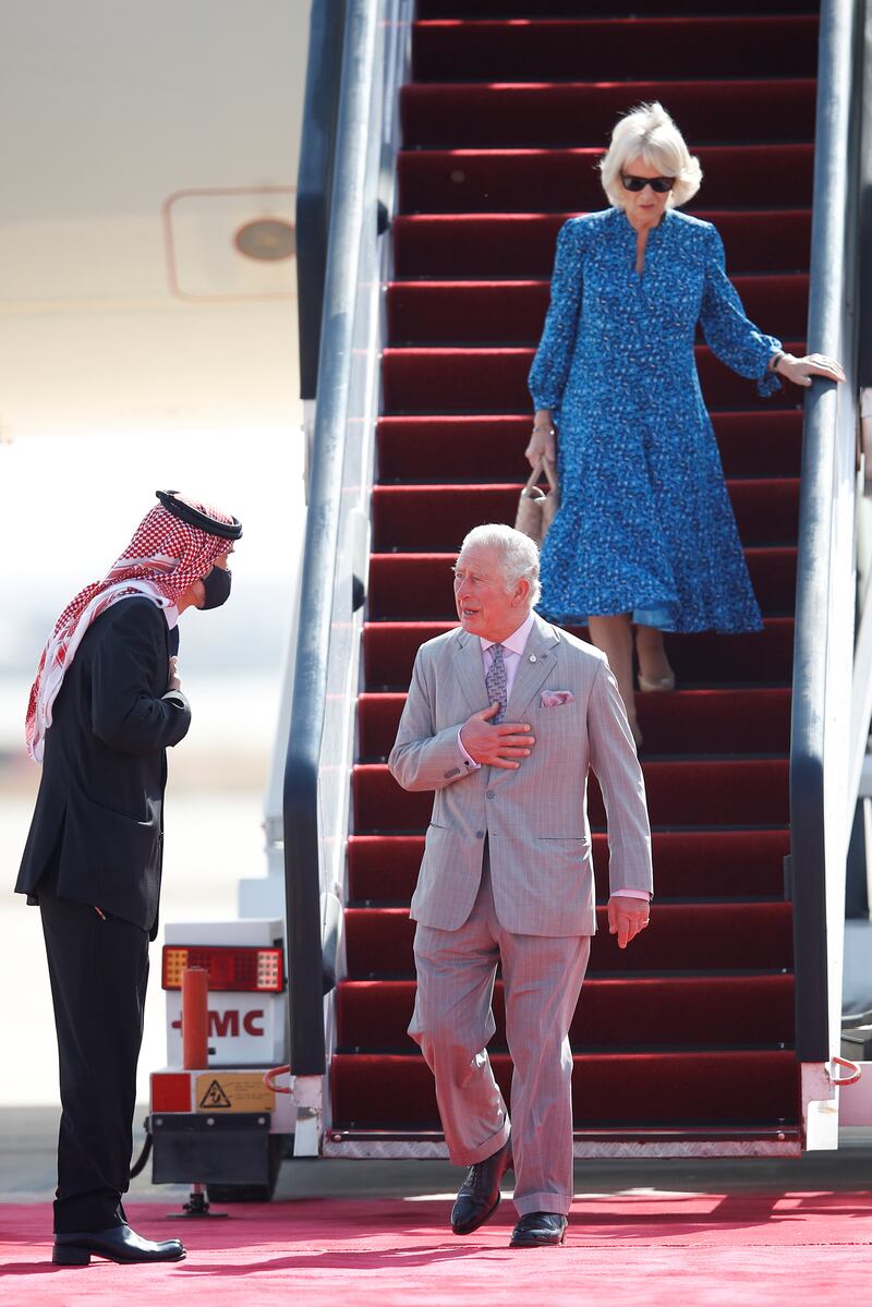 Prince Charles and Camilla are received by Prince Ghazi bin Muhammad, King Abdullah's cousin and adviser, at Queen Alia International Airport. Reuters