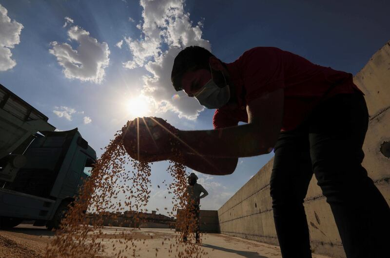 A worker inspects grain at a silo in Arbil, the capital of the northern Iraqi Kurdish autonomous region. AFP