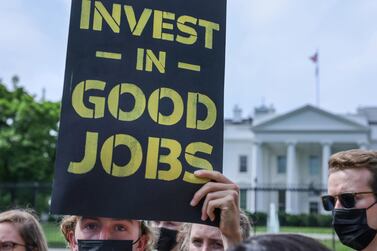 A protest outside the White House in Washington demands action on climate change and green jobs. Reuters