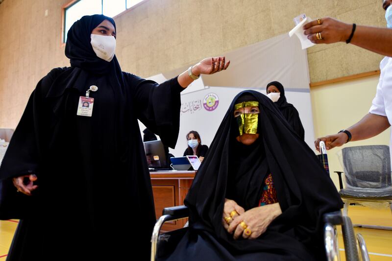 Qatari women arrive to cast their votes. Reuters