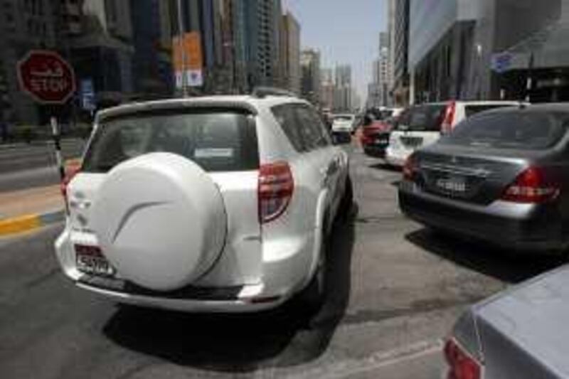 United Arab Emmirates - Abu Dhabi - Jun 22 - 2009 : A parked car blocking the other cars way in Hamdan St. ( Jaime Puebla / The National ) *** Local Caption ***  JP Bad Parking 05a.jpg