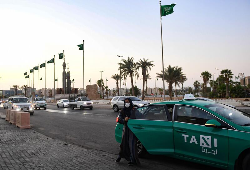 A woman walks out of a taxi in the Saudi city of Jeddah, on November 11, 2020. 
 A bomb blast struck a World War I commemoration attended by Western diplomats in the Saudi city today, leaving at least two people wounded in the second assault on diplomatic missions in recent weeks, officials said. / AFP / -
