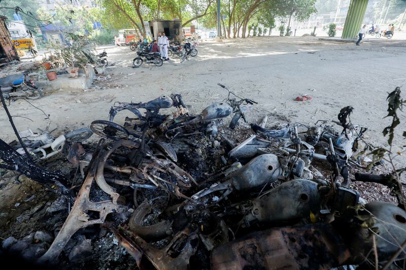 Motorcycles were also set on fire by Khan supporters. Reuters