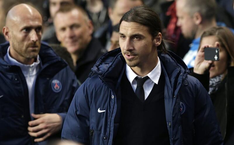 Paris Saint-Germain striker Zlatan Ibrahimovic, out with injury, walks to the technical area prior to Tuesday's match against Chelsea. Matt Dunham / AP / April 8, 2014