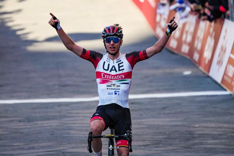 UAE Team Emirates rider Tadej Pogacar celebrates winning the Strade Bianche, in Siena, Italy, Saturday, March 5, 2022. AP