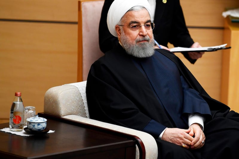 Iranian President Hassan Rouhani attends a meeting with Japanese Prime Minister Shinzo Abe during a meeting at the prime minister's office in Tokyo, Friday, Dec. 20, 2019. (Charly Triballeau/Pool Photo via AP)