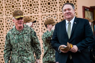 Vice Admiral James Malloy, commander of the US Naval Forces Central Command, walks with Secretary of State Mike Pompeo, after a tour of the US Naval Forces Central Command centre in Manama on January 11. Andrew Caballero-Reynolds / AFP