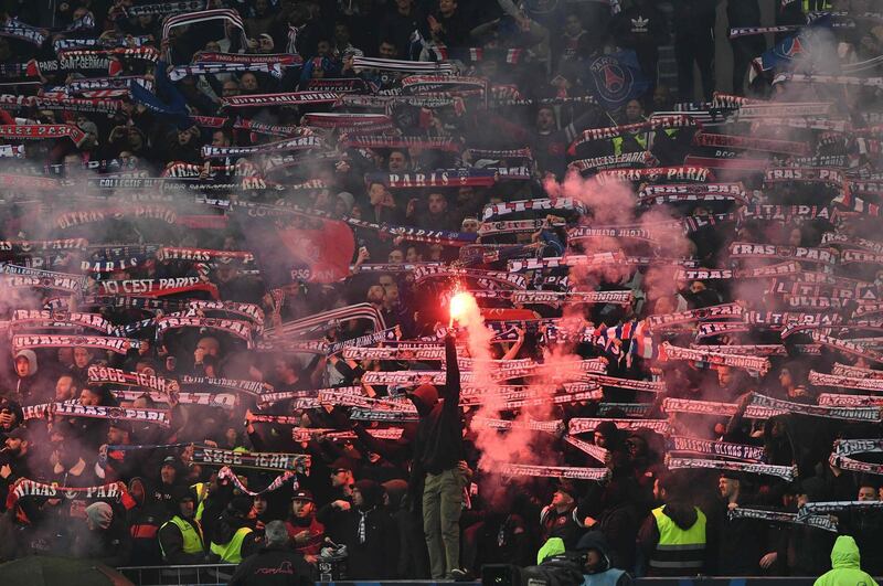 PSG supporters cheer for their team during the French Cup final against Rennes at Stade de France in Saint-Denis, outside Paris on Saturday night. Anne-Christine Poujoulat / AFP