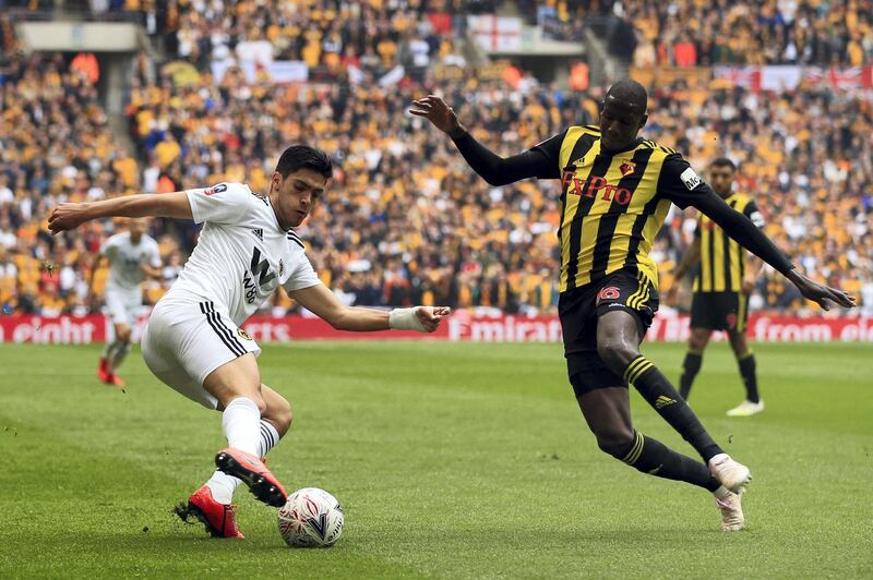 LONDON, ENGLAND - APRIL 07: Raul Jimenez of Wolverhampton Wanderers in action with Abdoulaye Doucoure of Watford  during the FA Cup Semi Final match between Watford and Wolverhampton Wanderers at Wembley Stadium on April 07, 2019 in London, England. (Photo by Marc Atkins/Getty Images)