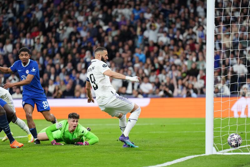 Karim Benzema of Real Madrid scores their first goal as Kepa Arrizabalaga of Chelsea looks on. Getty 