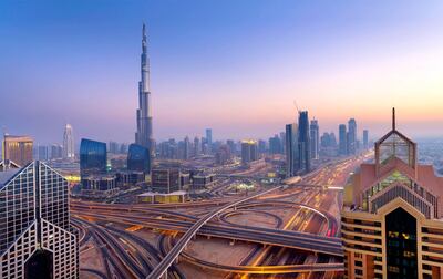 Dubai sky line with traffic junction and Burj Khalifa. Getty Images