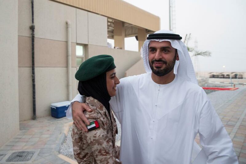 Sheikh Mohammed bin Hamad bin Tahnoon Al Nahyan congratulates his daughter, Sheikha Hassa, after she graduated from a programme at Khawla bint Alazwar military school.