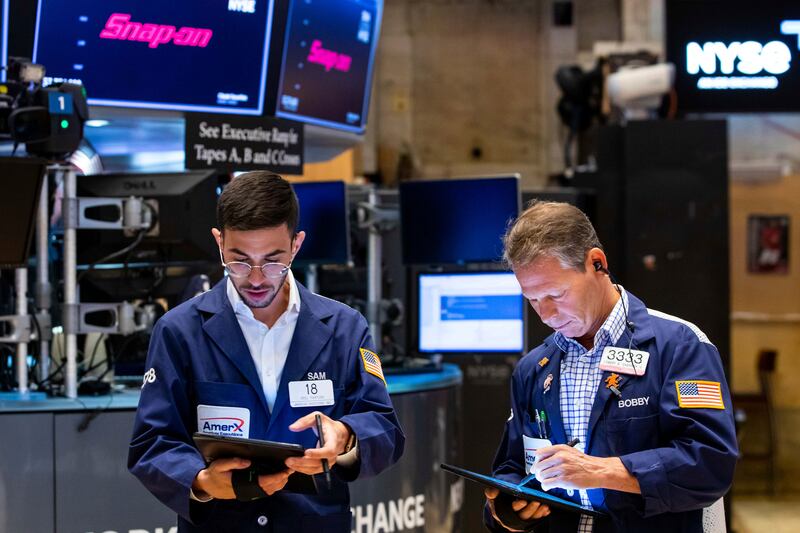 Traders work at the New York Stock Exchange. Stocks on Wall Street fell sharply on Friday as data showed inflation is getting worse, not better, as investors had been hoping. AP