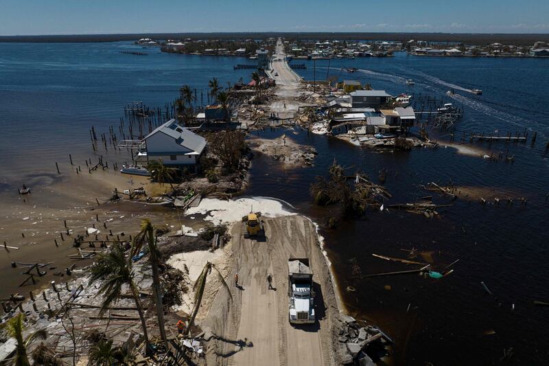 Emergency repairs to restore road access in the aftermath of Hurricane Ian in Matlacha, Florida. The confirmed death toll from Hurricane Ian, which hit the south-east United States last week, has risen to at least 62, officials said. AFP