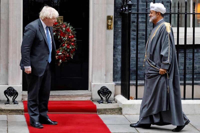Britain's Prime Minister Boris Johnson greets Sultan Haitham bin Tariq Al Said upon his arrival. AFP