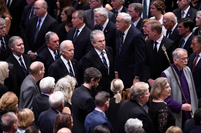 US former Vice President Joe Biden (C left) and actor Warren Beatty (C) arrive for the National Memorial Service.  AFP