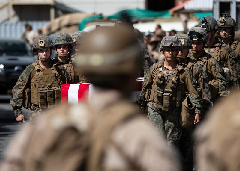 US Marines attend a ceremony at Hamid Karzai International Airport for service members killed in action. Reuters