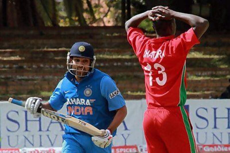 Rohit Sharma, left, scored an unbeaten 64 as India won the fourth ODI against Zimbabwe in Bulawayo on Thursday. Tsvangirayi Mukwazhi / AP Photo