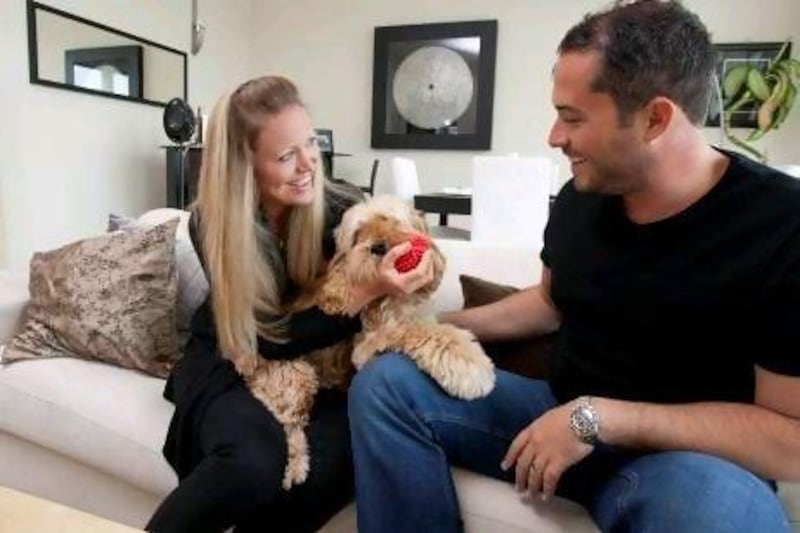 Sam and Lucy Dulka at home with their dog Crunchie, a 16-month-old Cocker Spaniel.