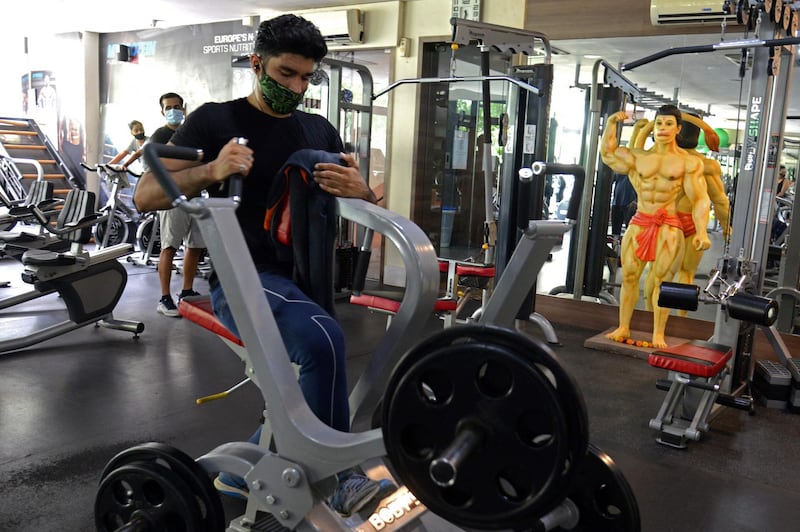 People workout at a gym in Mumbai, as India's financial hub.