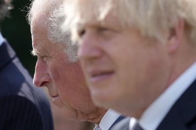 Britain's Prime Minister Boris Johnson, right, and Prince Charles attend the dedication ceremony of the new national UK Police Memorial at the National Memorial Arboretum in Alrewas, central England, in July 2021. AFP