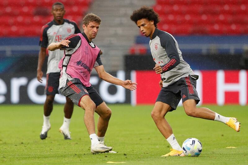 Bayern Munich winger Leroy Sane and forward Thomas Muller take part in a training session in Budapest. AFP