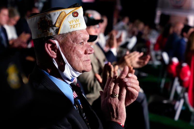 A veteran applauds as he waits to hear Vice President Mike Pence speak on the third day of the Republican National Convention at Fort McHenry National Monument and Historic Shrine in Baltimore. AP Photo