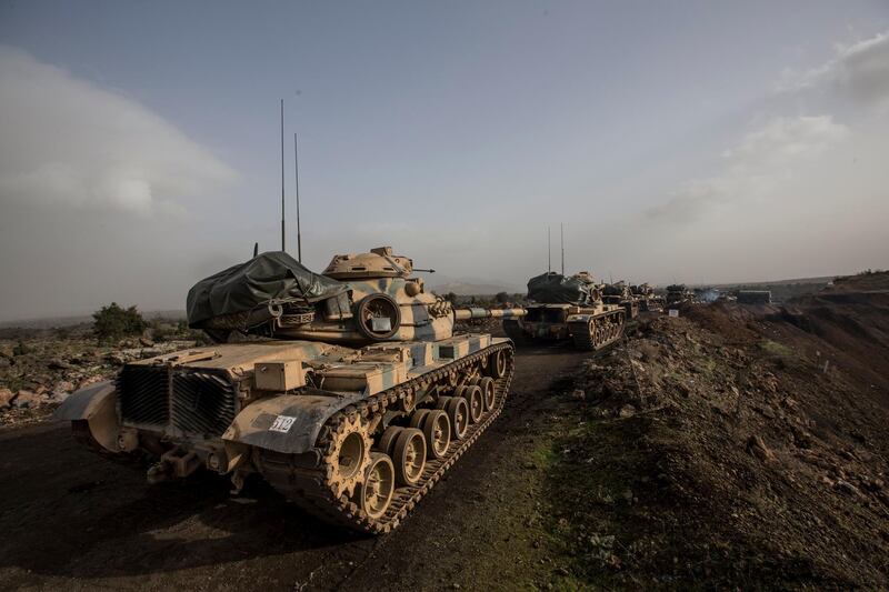 Tanks wait near the border in Hassa district of Turkey's Hatay province on January 22, 2018 as the Turkish prepares for an offensive on Syrian Kurd fighters in northern Syria. Sedat Suna / EPA