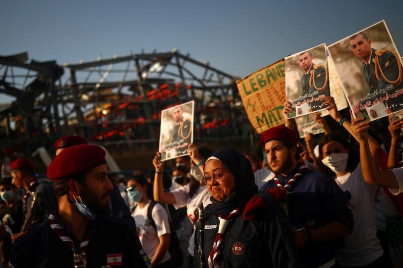 People take part in a vigil for the victims lost in a massive explosion, in Beirut. Reuters