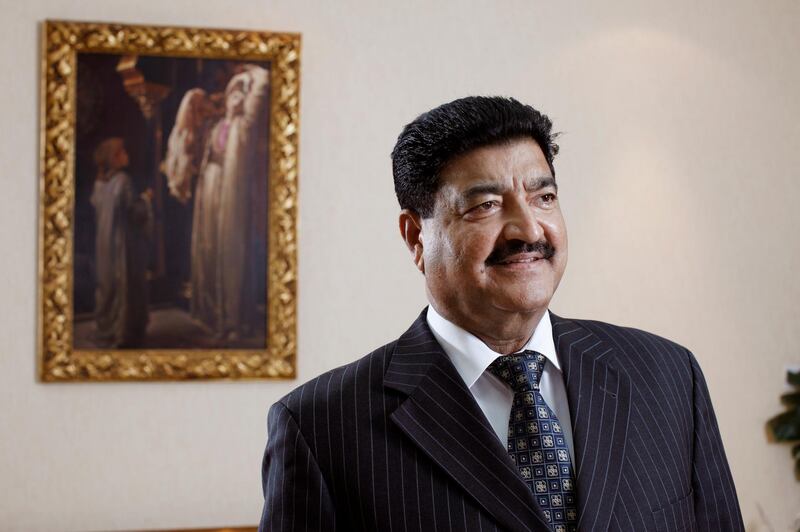 ABU DHABI, UNITED ARAB EMIRATES - December 31, 2009: Dr B. R. Shetty, Managing Director and CEO of NMC Group (NMC Specialty Hospital, UAE Exchange, Neopharma) stands for a portrait in his office. 
( Ryan Carter / The National ) *** Local Caption ***  RC003-DrShetty20091231.jpg