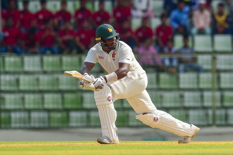 Zimbabwe cricket captain Hamilton Masakadza plays a shot during the first day of the first Test cricket match between Bangladesh and Zimbabwe in Sylhet on November 3, 2018. / AFP / MUNIR UZ ZAMAN
