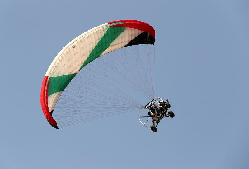 RAS AL KHAIMAH , UNITED ARAB EMIRATES , JUNE 07 – 2018 :- One of the paraglider of UAE Rescue team giving demo at the Jazirat Al Hamra in Ras Al Khaimah.  ( Pawan Singh / The National )  For News. Story by Nawal