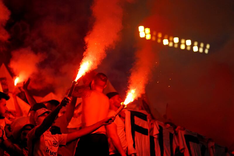 Eintracht Frankfurt fans with flares. PA