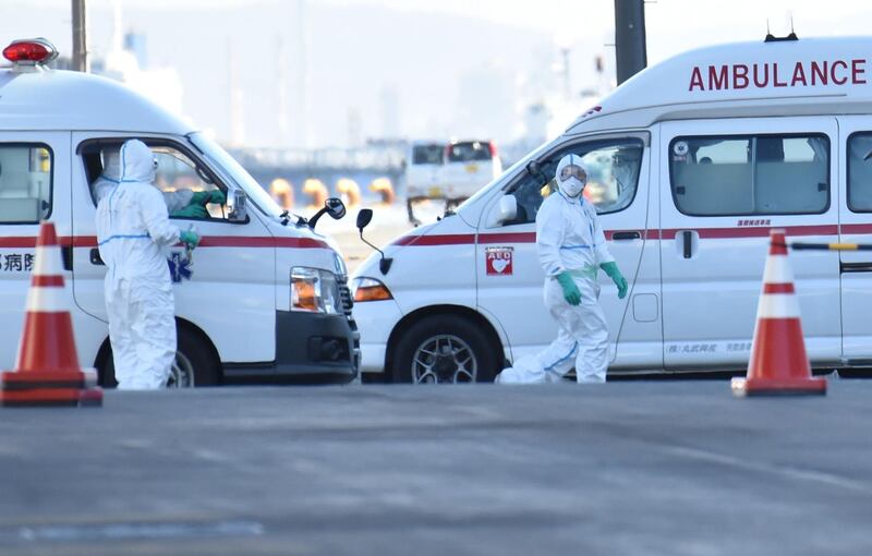 Ambulances wait to transfer patients who tested positive for the new coronavirus from the Diamond Princess cruise ship docked off the coast of Japan. AFP