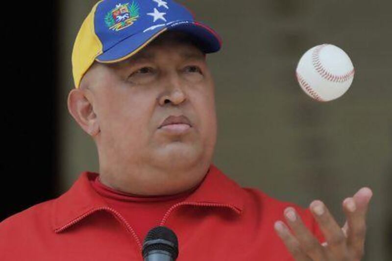 Hugo Chavez plays with a baseball during a broadcast at the presidential palace Miraflores in September, 2011.