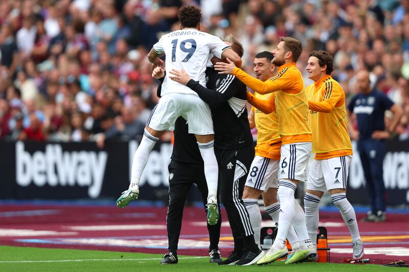 Rodrigo of Leeds United celebrates with teammates Marc Roca, Liam Cooper and Brenden Aaronson after scoring the team's first goal. Getty 