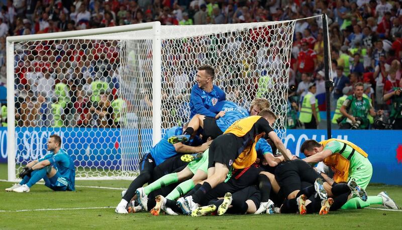 Croatia's Ivan Rakitic celebrates with team mates after scoring the deciding penalty during the shootout. Maxim Shemetov / Reuters