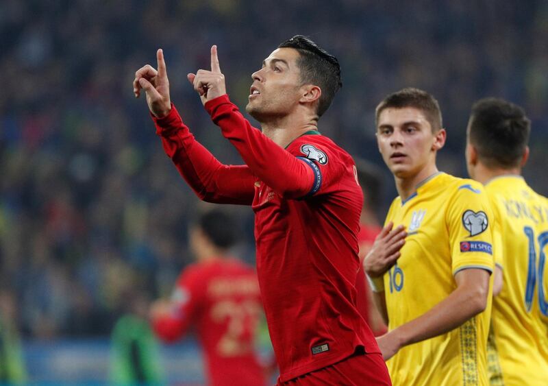 Soccer Football - Euro 2020 Qualifier - Group B - Ukraine v Portugal - NSC Olympiyskiy, Kiev, Ukraine - October 14, 2019  Portugal's Cristiano Ronaldo celebrates scoring their first goal from the penalty spot   REUTERS/Valentyn Ogirenko