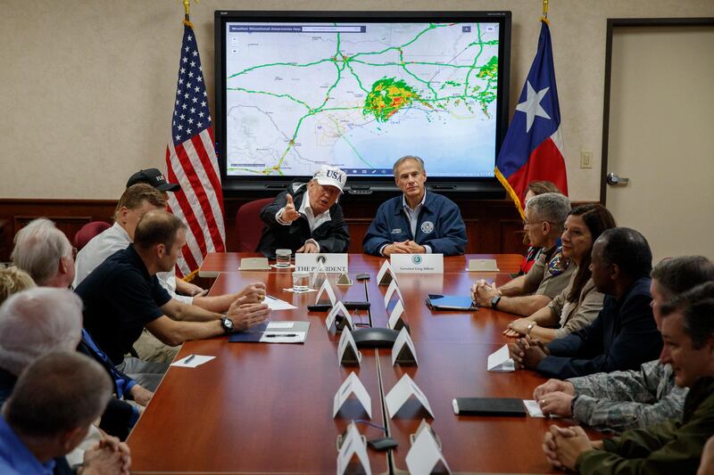 President Donald Trump, accompanied by Texas governor Greg Abbott, speaks at the the Texas Department of Public Safety Emergency Operations Center in Austin, Texas. Evan Vucci / AP Photo